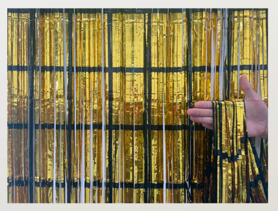 CORTINA METALIZADA DOURADA C/ PRETO 1X2MT