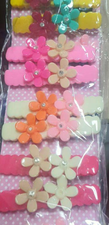 PRESILHA FLOR PLASTICO C/12