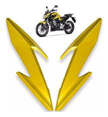 CARENAGEM LAT. DO FAROL COMP.A MOTO CBF 300 23 A 24 DOURADO NAO ORIG